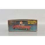 A Chinese battery operated tinplate car model, Photoing On Car, boxed.
