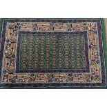 A mid 20th century Persian woollen mat, of rectangular form with a central pink and green all-over