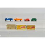 Three boxed Tri-ang Minic clockwork Morris Van models, including a hard to find Minic Transport' Van