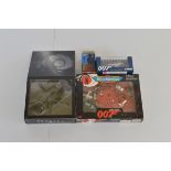 A small collection of James Bond 007 diecast models, including an Italieri Skyfall helicopter, Corgi