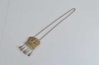 A Chinese white metal chatelaine, on chain with five drops with matching white metal bells. 50cm
