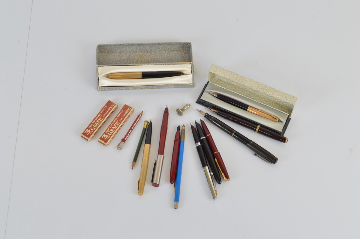 A collection of assorted fountain pens and pencils, including a Swan Mabie Todd and Parker Duofold