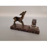 A French Art Deco desk calendar, the marble base surmounted with a spelter faun, and chromed