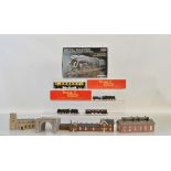 A mixed lot of model railway, including two OO gauge Tri-Ang wagons, Monogram metal master model