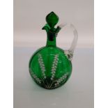 A 19th century Mary Gregory green glass and enamel decanter and stopper, with lily of the valley