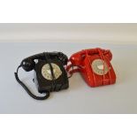 Two modern rotary dial telephones, one in black one in red (2)