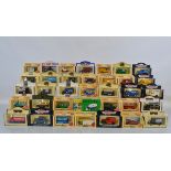 Sixty boxed Lledo Days Gone diecast models, with some loose examples and a boxed Vanguard model