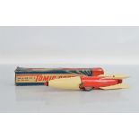 A very scarce boxed 'Tomic Rocket' model, approximately 37cm long, manufactured by International
