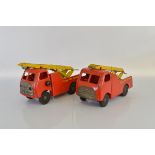 Two unboxed Tri-ang TM6015 Pressed Steel Fire Engine models from their 'Diesel' series,