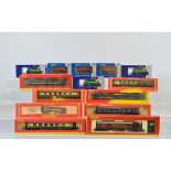 A quantity of boxed OO gauge rolling stock, including Hornby Royal Mail coaches, Roco, Dapol,