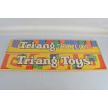 Two vintage famed Tri-ang retailer paper signs, including 'Tri-ang Toys' and 'Tri-ang Tricycles'
