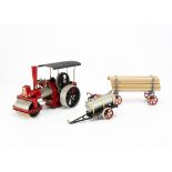 A Wilesco Live Steam 'Old Smoky' Steam Roller with Lumber Wagon and Water Cart, the roller in red/