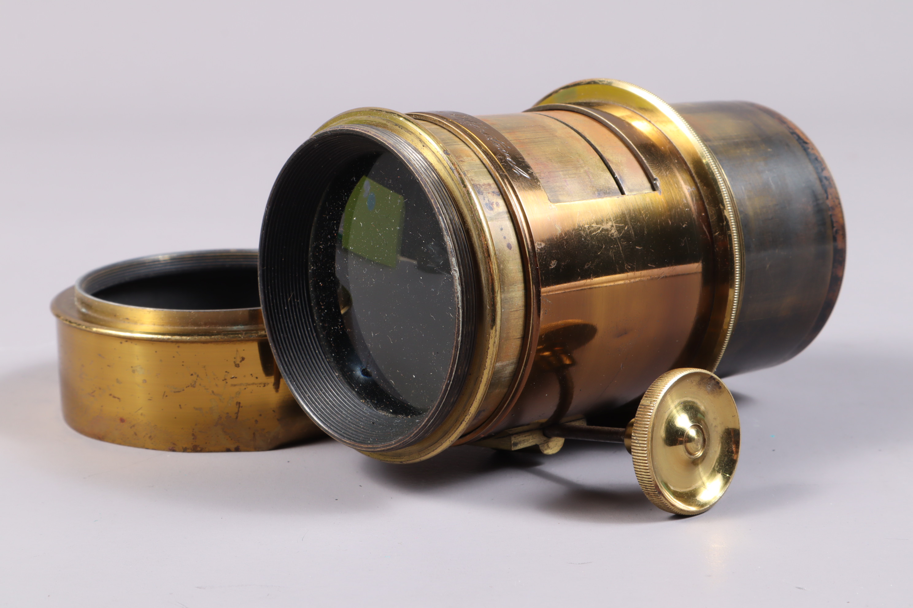 A Perken Son & Rayment Optimus Projection Lens, brass lens, barrel F, rack and pinion focus, focal