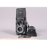 A Rolleiflex 3.5F TLR Camera, serial no 2217099, shutter working, meter responsive, body G, light