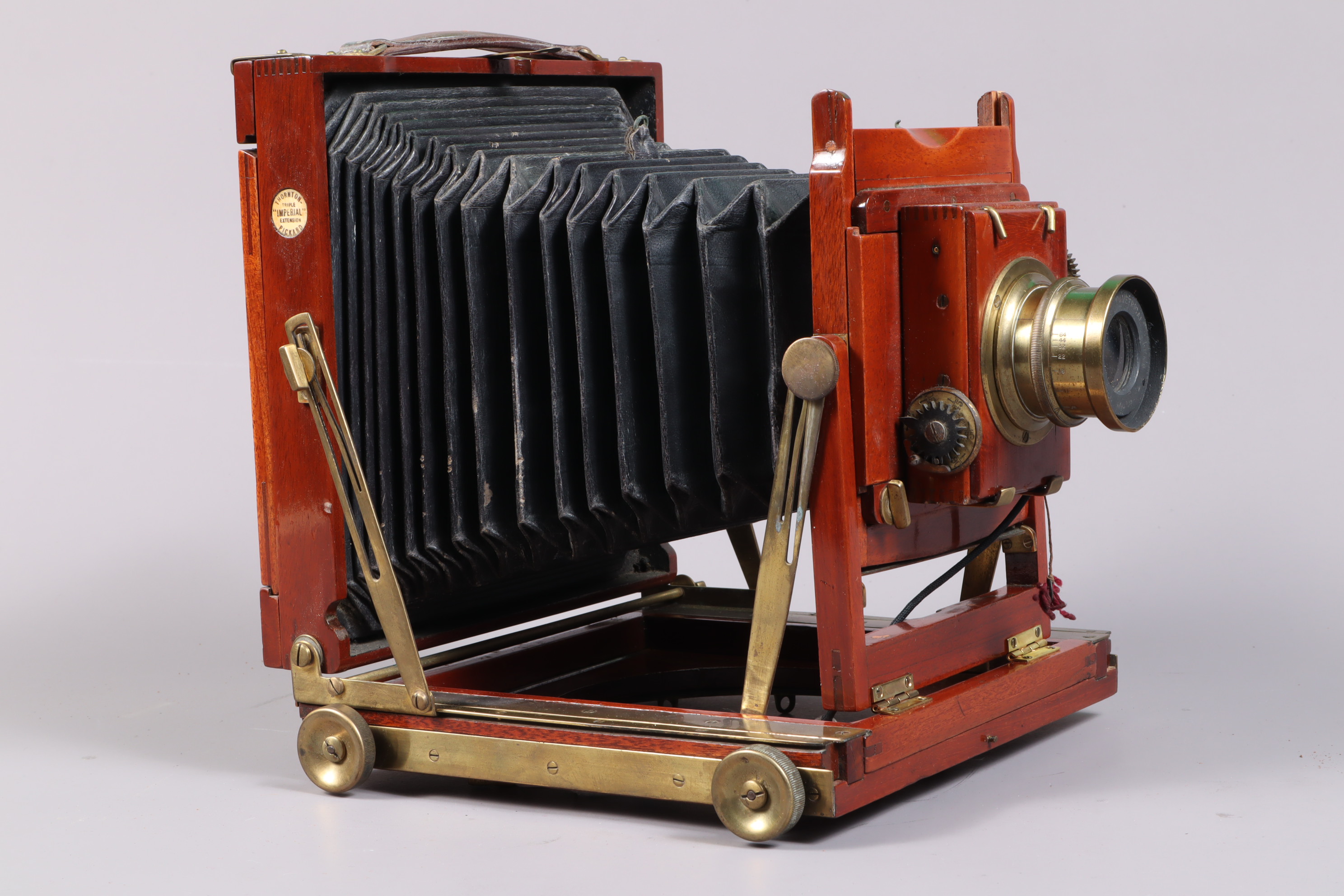 A Thornton Pickard Imperial Triple Extension Half Plate Field Camera, tapered chamfered-corner black