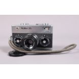 A Rollei 35 Compact Camera, made in Singapore, shutter working, meter functions, body G-VG, with