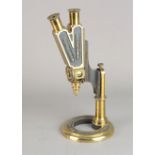 A mid-19th Century lacquered brass Smith Beck & Beck Universal Wenham's Binocular Microscope, serial
