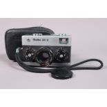 A Rollei 35 S Compact Camera, chrome, made in Singapore, serial no 6551790, shutter working, meter