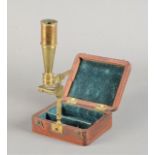 A mid-19th Century lacquered brass Cary Pocket Compound Monocular Microscope, signed 'Cary, London',