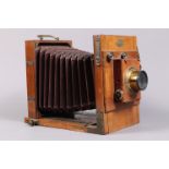 A Jules Reygondaud 7 x 5in Tailboard Camera, circa 1885, tapered chamfered-corner tan bellows,