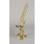 A 19th Century lacquered brass Negretti & Zambra Compound Monocular Microscope, with eyepiece,