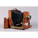 A Thornton Pickard Half Plate Field Camera, tapered square-cornered black bellows, triple extension,