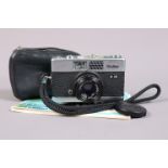 A Rollei B35 Compact Camera, chrome, made in Germany, shutter working, meter responsive, body G,