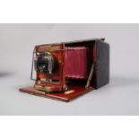 A Premo A 4x5 Quarter Plate Folding Camera, body G, scuffs to leatherette, bellows G, with Ensign