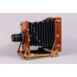 A Gandolfi Precision Half Plate Field Camera, polished mahogany body G, some marks from use, with