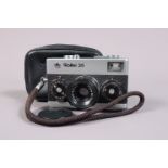 A Rollei 35 Compact Camera, chrome, made in Singapore, serial no 3478388, shutter working, meter