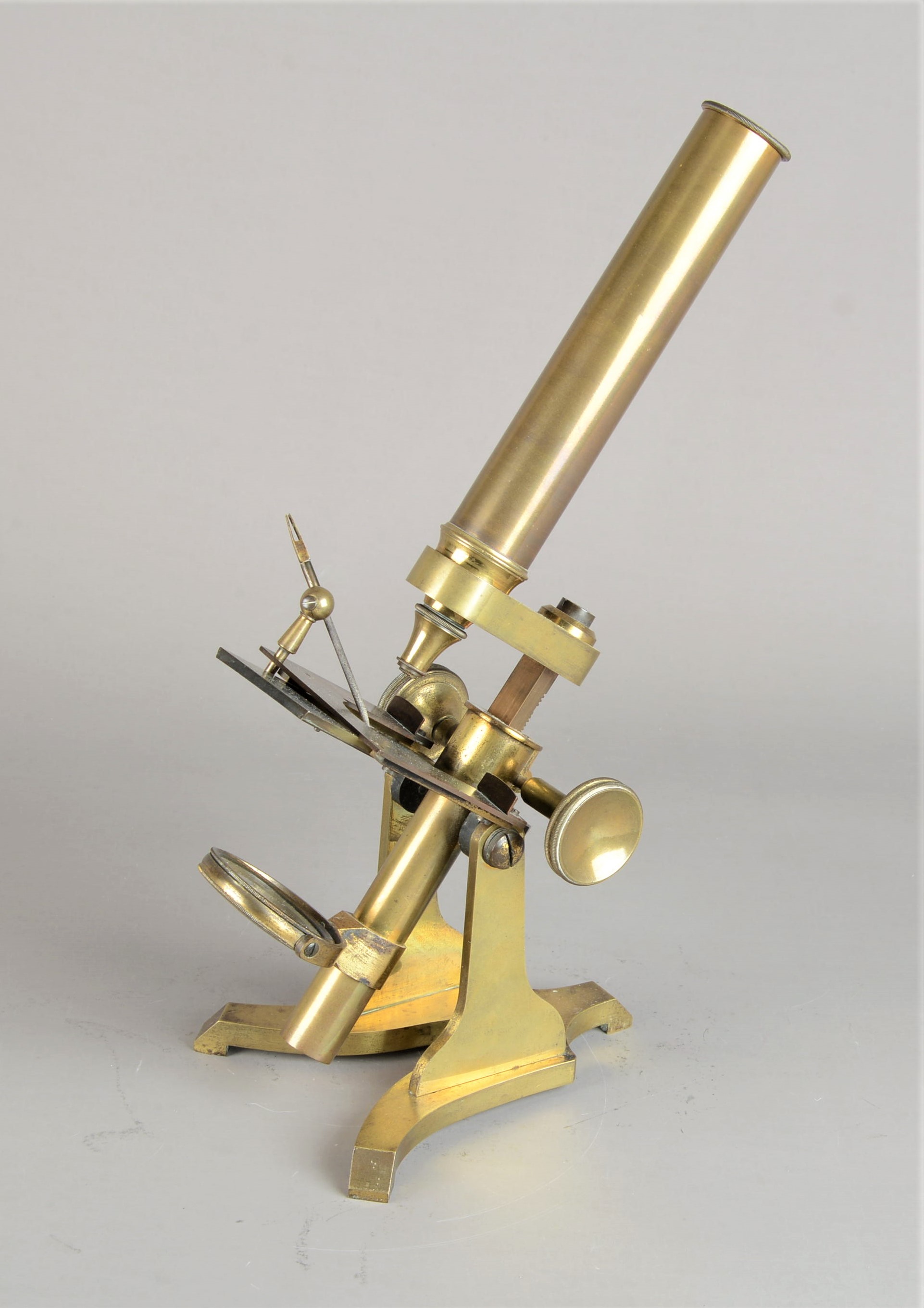 A 19th Century lacquered brass Baker Compound Monocular Microscope, with eyepiece, rack and pinion