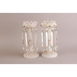 A pair of Edwardian glass lustres, frosted glass bases with gilt and applied glass decoration and