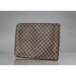 A Louis Vuitton document wallet in damier fabric, unused; with red leather embossed leather label