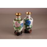 Two Chinese cloisonne vases, 18cm, with wooden stands (4)