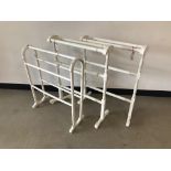 A pair of Edwardian white painted towel rails, together with another (3)