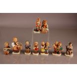 Nine mid 1960s and 1970s Goebel porcelain Hummel figures of boys and girls, including Joyful, Home