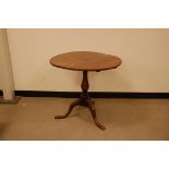 A Georgian mahogany wine table, 76cm diameter tilt top with nice carved rim on tripod base also with