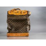 A Louis Vuitton saddle bag in LV fabric, blonde leather and gilt hardware, opening to one side at