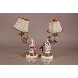 A pair of first half 20th century lamps, having Dresden porcelain figures on circular marble bases