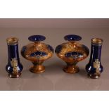 A pair of Art Nouveau style Royal Doulton stoneware squat vases, 14.5cm, together with a pair of