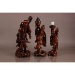 Three mid 20th century Chinese carved hardwood figures, tallest 42cm, as an immortal with dog of fo,