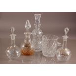 Four Victorian and later glass decanters and a cut glass ice bucket, including a pair with painted