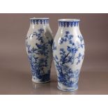 A pair of early 20th century Japanese blue and white porcelain vases, 37cm, nicely painted with a