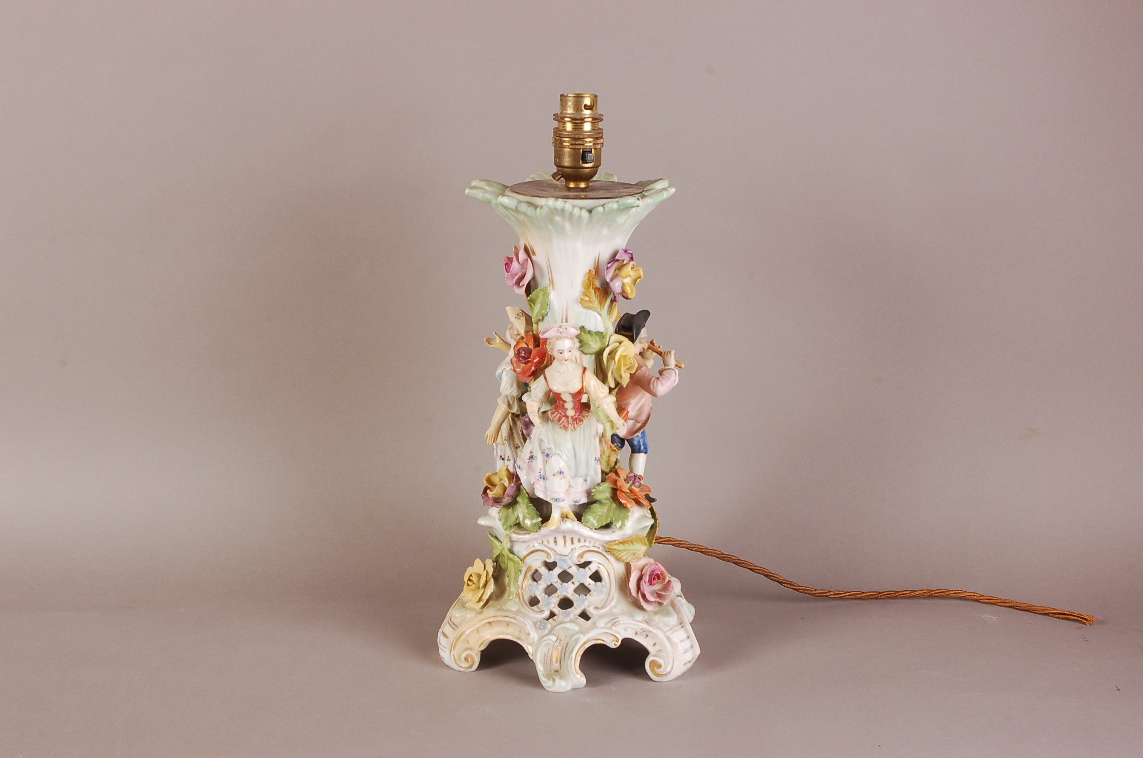 An early 20th century Dresden porcelain lamp base, 31cm plus light fitting, the rococo themed base