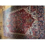 A large early 20th century Middle Eastern carpet, with label marked from Iran, and made in Italy