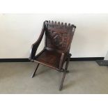 An early 20th century oak Priest's chair