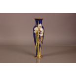 An early 20th century Art Nouveau style Doulton Burslem slender vase, 35cm, with lilies to front and