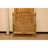 A late 19th century French carved wooden single bed frame, 1m wide, with rattan to headboard, and