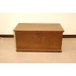 An 18th century oak chest, engraved S T to front, with later divisions to interior, 101cm wide