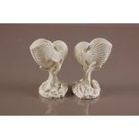 A pair of Royal Worcester blanc de chine nautilus shells, 17cm high, with green backstamps and